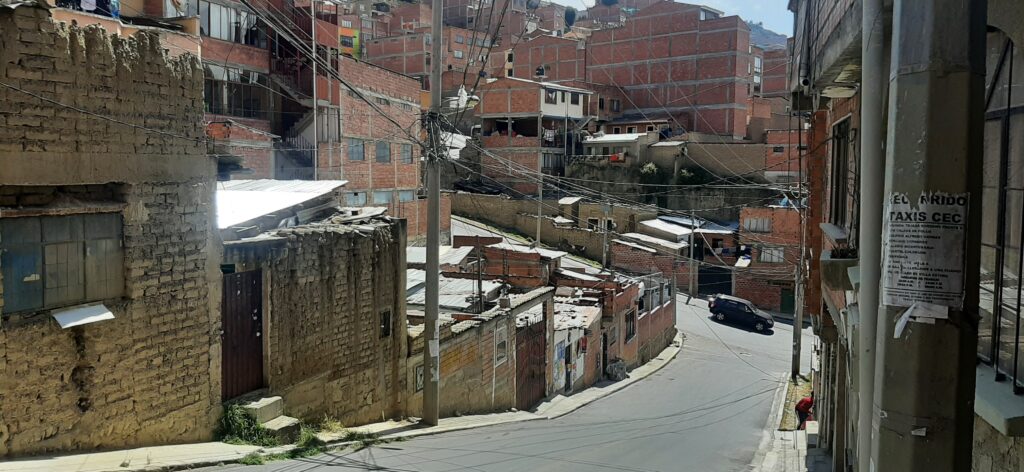 Poor peoples houses made with adobe or orange bricks in the Altiplano La Paz Bolivia